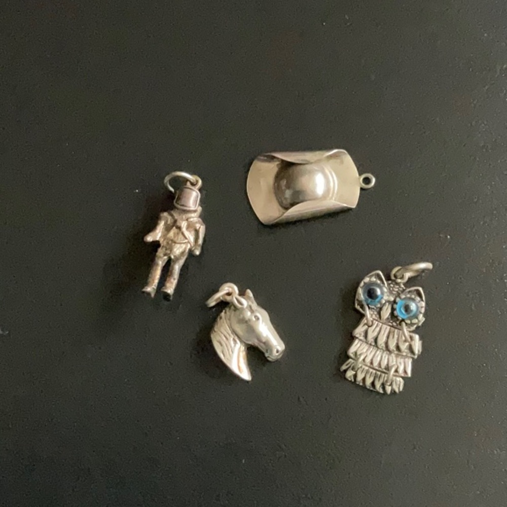 Four silver vintage charms.  Astronaut, hat,  owl and horse